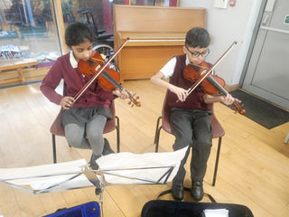 Our Young Violinists in Action