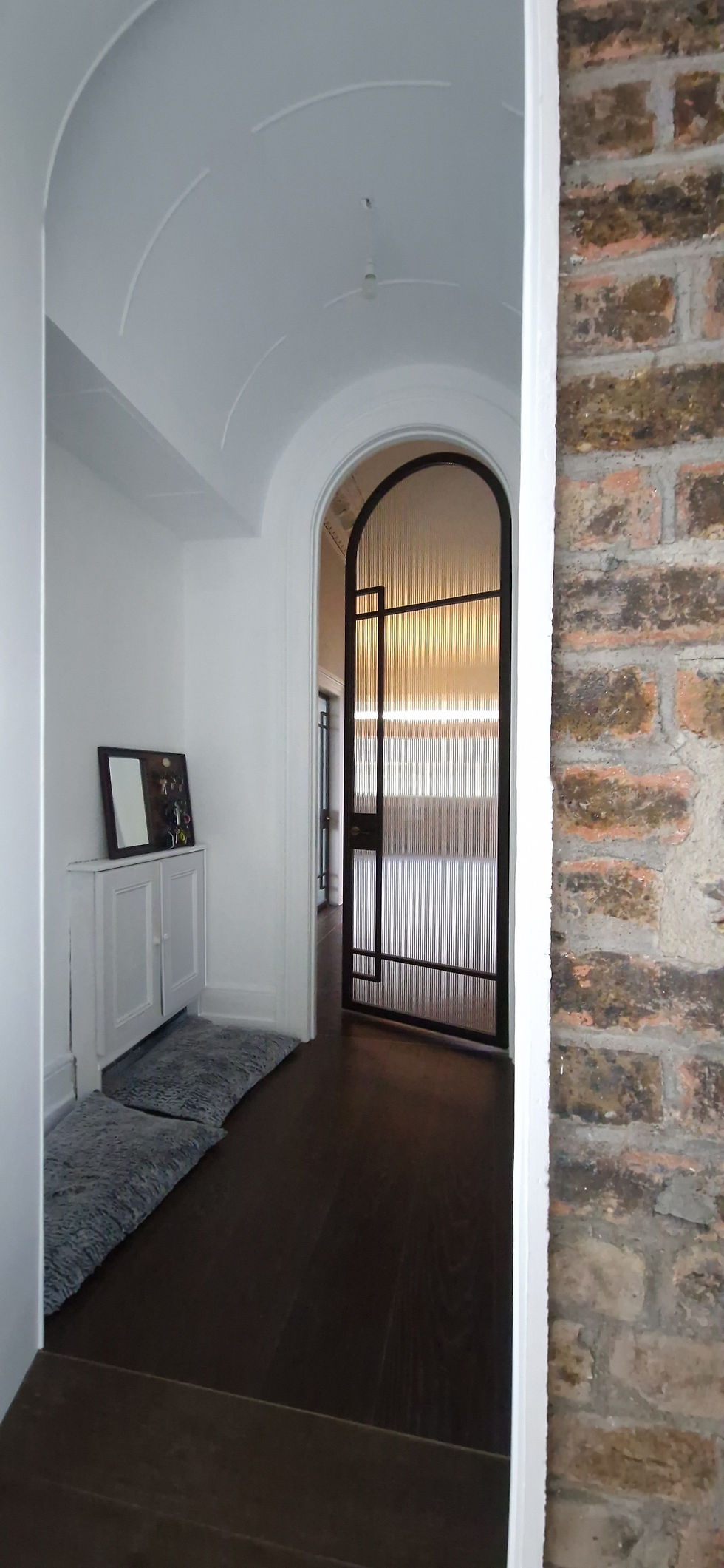 This project features elegant and stylish glass door designs, including arched doorways with textured glass, modern metal-framed glass doors, and sleek glass double doors with black metal frames.