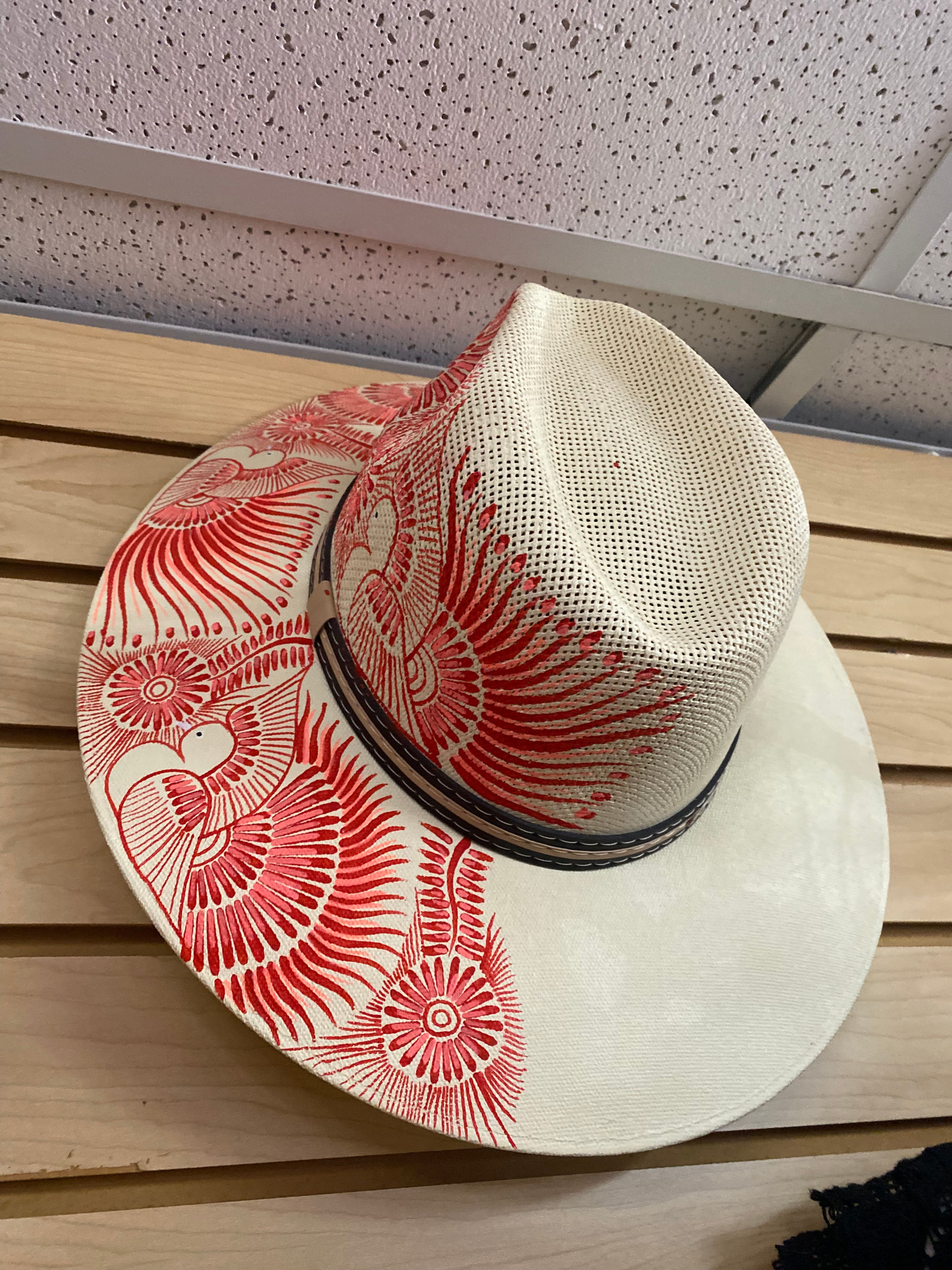 Hand-painted Mexican straw hat with colorful artisan design, handmade and unique fashion accessory