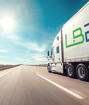 a white sleeper truck with logo_edited_edited_edited_edited.jpg