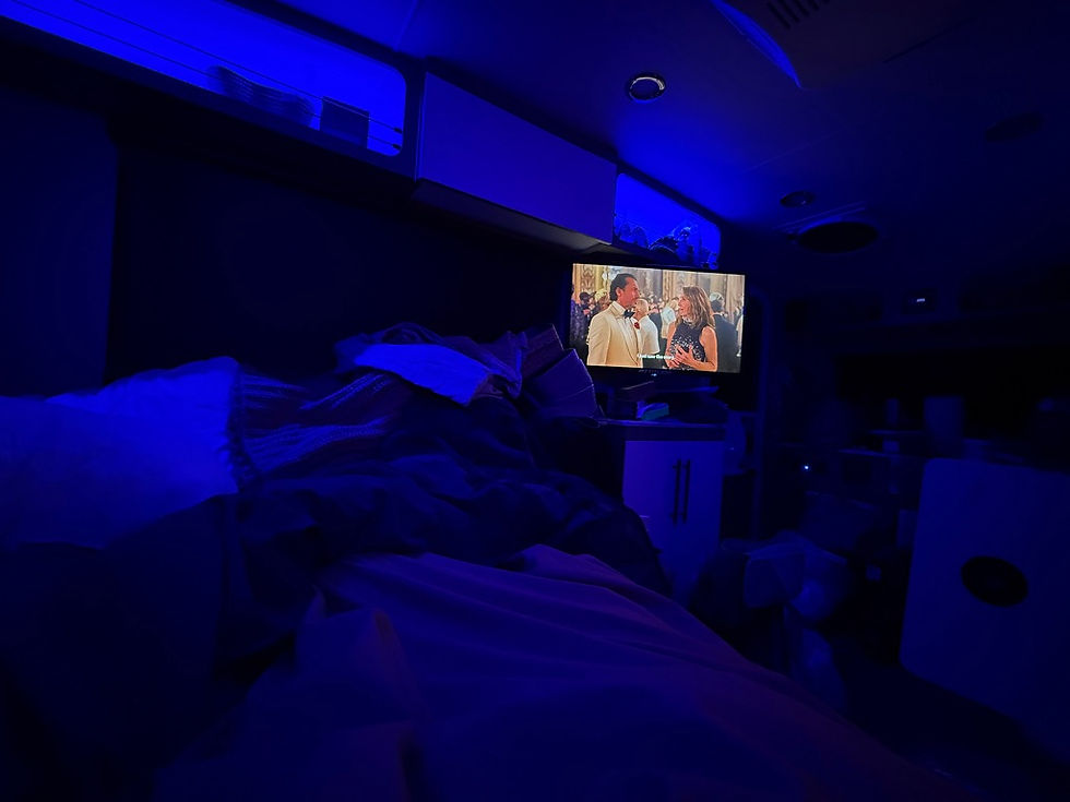 Starlink connected. Victory declared. First night movie in the books. Tucked in, comforter on, rain on the roof. Home.