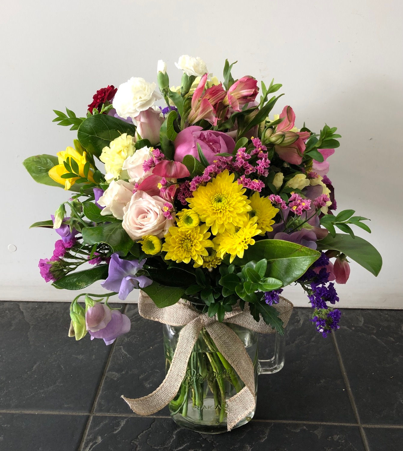 Seasonal Flowers in a glass vase