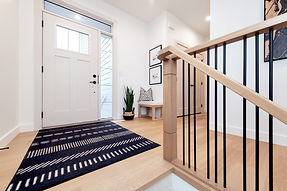 Contemporary posts & railing with clean lines spindles in a pattern.