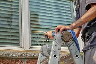 Windows being cleaned in Minnesota as part of "The Works" package at Glass House Window Cleaning.