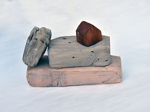 small woooden sculpture from exhibition of urban industrial artworks by Glenn Locklee