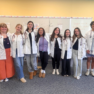 Monson High School Medical Assisting students wearing clinical lab coats in the school’s healthcare pathway classroom.