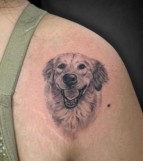 Custom tattoo on a shoulder of a realistic smiling dog portrait, capturing the warmth and joy dogs bring, often searched as best tattoo for pet lovers. hand tattoo, tattoo hand tattoo, tattoo shop near me,
tattoos