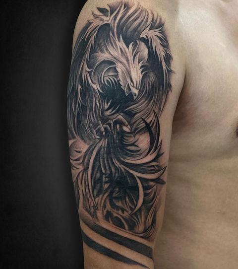 Detailed phoenix sleeve tattoo at Guns & Inks studio, Hyderabad's best destination for top-tier custom tattoos and inks. tattoo tattoos, tattoo designs, armband tattoo.