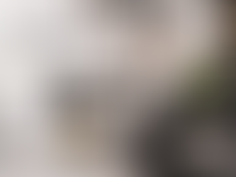 Clean and hygienic tattoo studio setup at Guns and Inks in Kondapur, Hyderabad, featuring a professional tattoo chair, ring light, organised ink station, sterile workstation trolley, framed tattoo artwork and a modern studio interior designed for safe tattooing and client comfort.