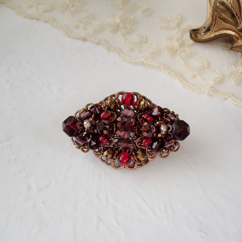 Thumbnail: DARK RED BROOCH in oval shape