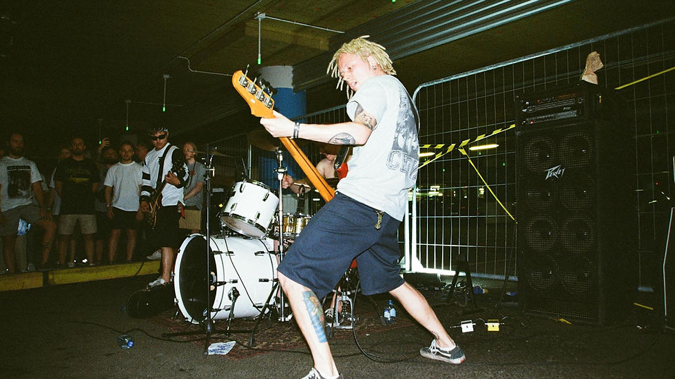 Dynamic live music performance with a band playing in an urban parking lot.