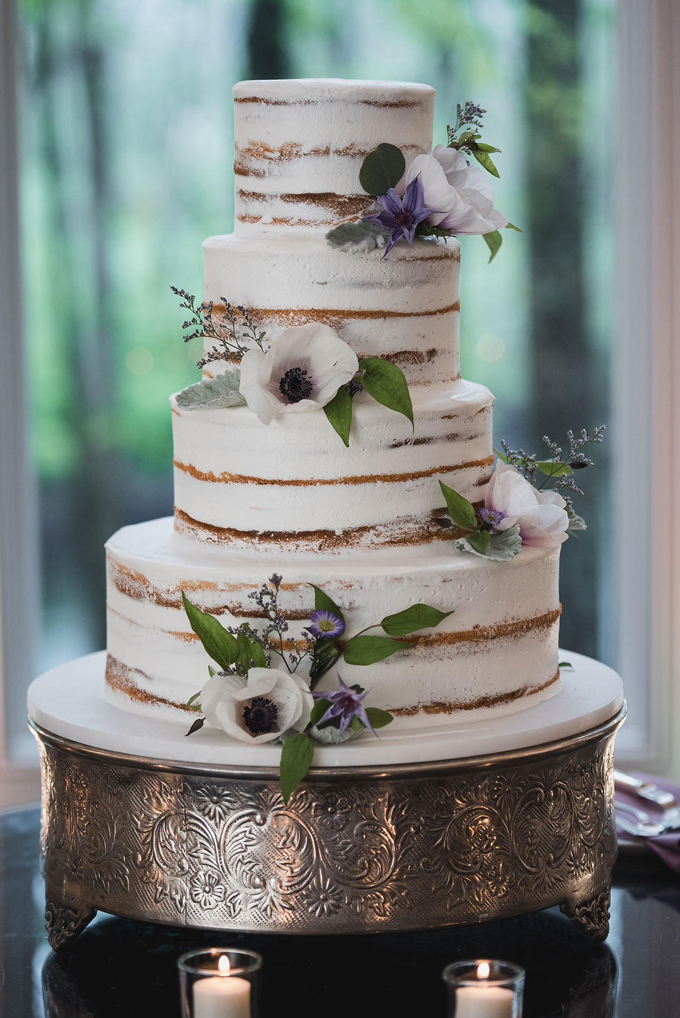 Kaitlyn & Kevin's wedding cake with purple throughout