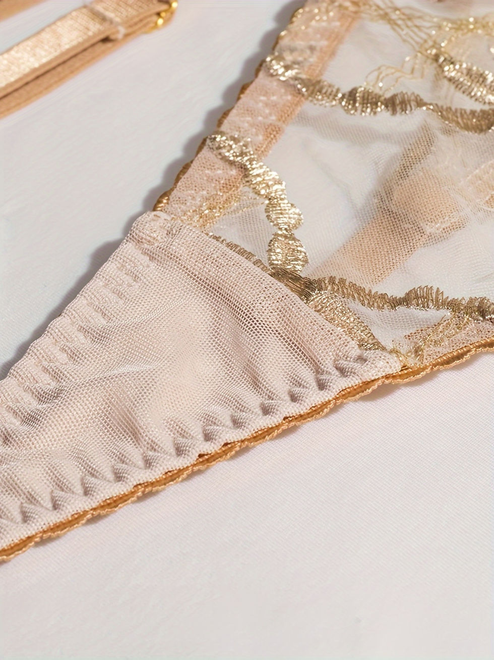 Thumbnail: Sheer gold embroidered lingerie set and matching garter belt.