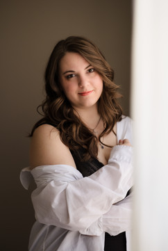 black lingerie with white mens button down / boudoir pose standing by window playing in curtains during knoxville boudoir photo session / knoxville boudoir photography / photo by Knoxville boudoir photographer Rosewood Boudoir / see more at rosewoodboudoir.com