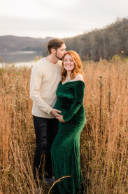 expecting mom and dad snuggle into each other during Knoxville TN maternity portrait session photo by Knoxville maternity, newborn, and family photographer Wood Shutter Photography