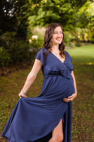 expecting mother in navy blue chiffon gown during Knoxville TN maternity portrait session photo by Knoxville maternity, newborn, and family photographer Wood Shutter Photography