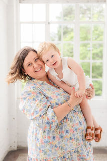 mom and son in the white room at the bleak house during Knoxville TN family portrait session photo by Knoxville maternity, newborn, and family photographer Wood Shutter Photography