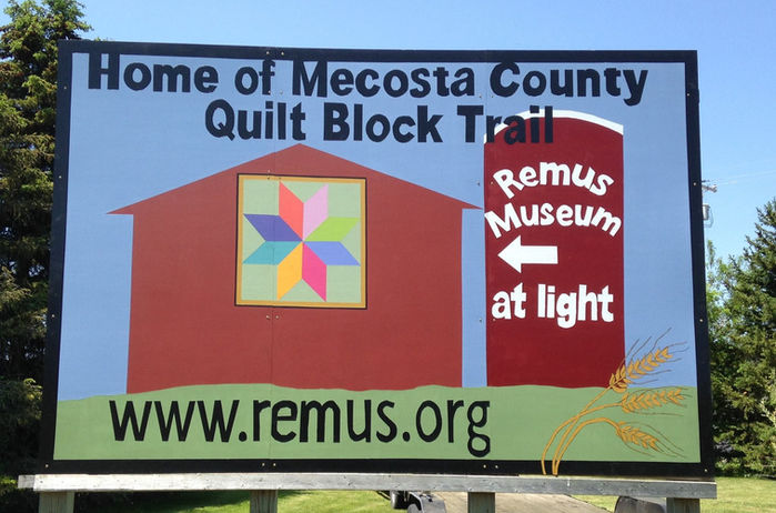 Sign: Home of Mecosta County Quilt Block Trail, Remus Museum, www.remus.org