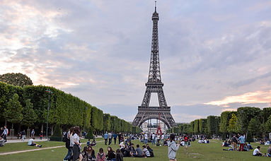 crowd-park-by-eiffel-tower-against-sky.jpg