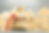 Money bag marked 2025 with upward arrow surrounded by wooden house models representing real estate market growth