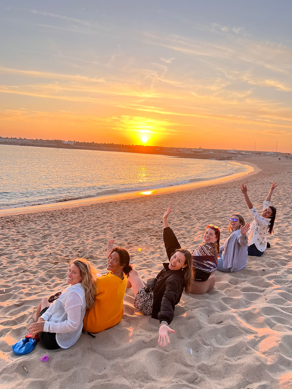 womens wellness retreat in portugal watching a sunset on the beach