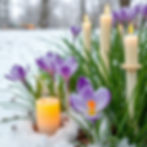 Eye-level view of a traditional Imbolc altar with candles and spring flowers