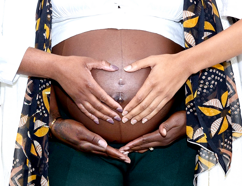black midwife in houston, texas hands on belly
