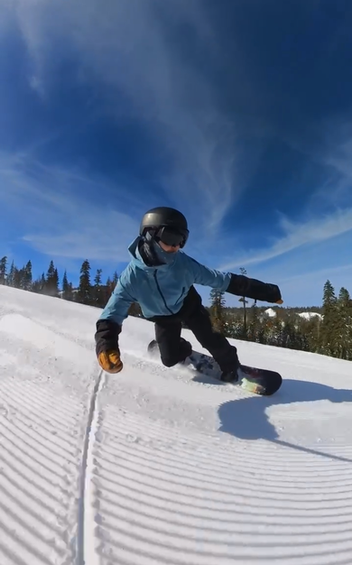 Chris Ball carving on a snowboard at Homewood Mountain Resort, Lake Tahoe