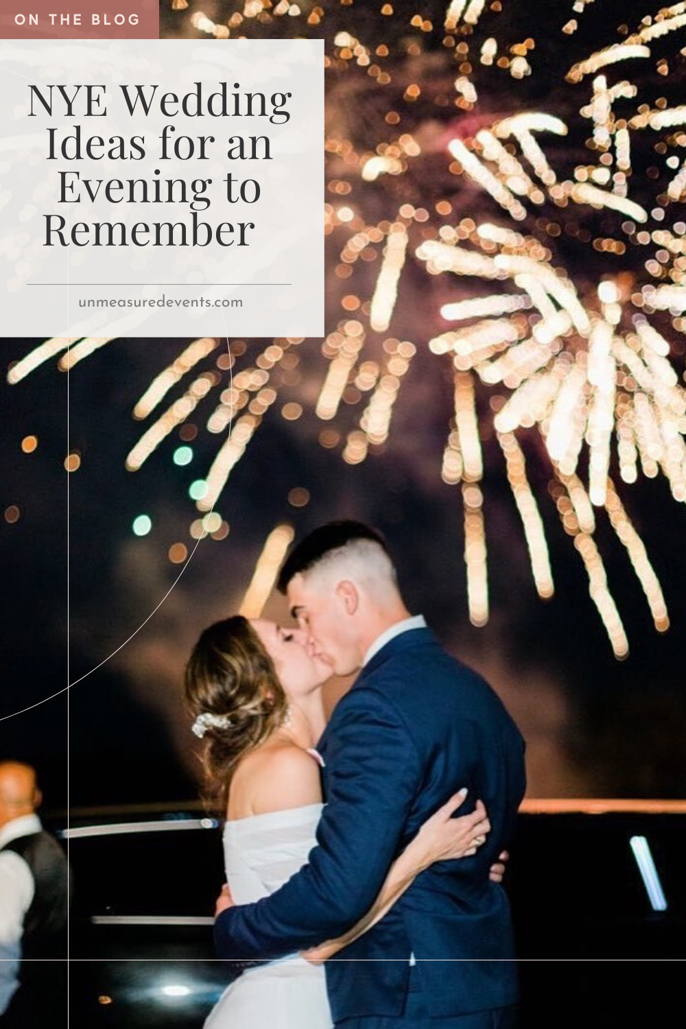 Cover photo for the unmeasured events blog that features a couple kissing and embracing infront of a fireworks display. The title card is on display at the top left corner of the photo. Bride and groom are wearing a suit and gown respectively