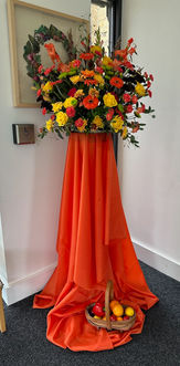 People arriving at the church are greeted by a beautiful arrangement of flowers and fresh fruit in the front porch.