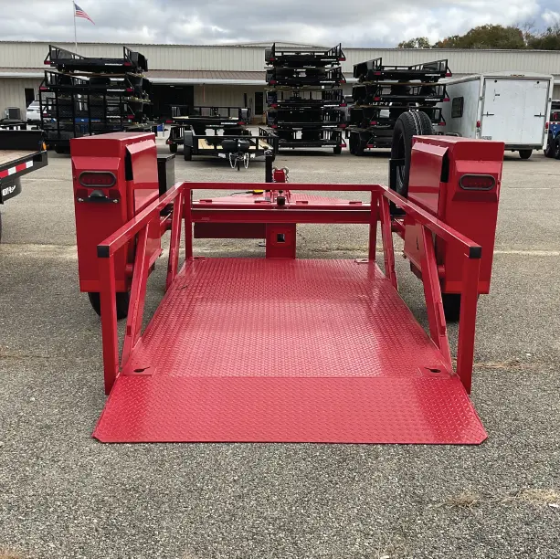 Small red scissor lift trailer lowered to the ground. Direct rear view. 
