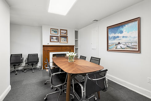 2nd floor conference room. There is a table, 8 seats, and fireplace