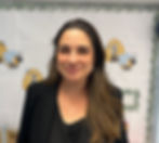 Smiling woman with long brown hair poses for photo at Bright Starts Daycare