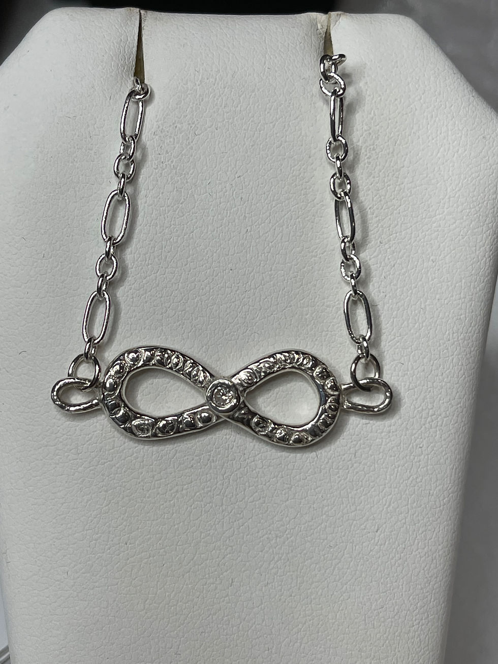 Infinity symbol pendant w/diamond cz