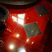 Glossy red floor tile installation completed in Manhattan, NY.