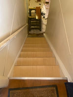 Interior stairway in Merrick NY being refaced with quarter-inch plywood before staining for a refreshed and durable finish.