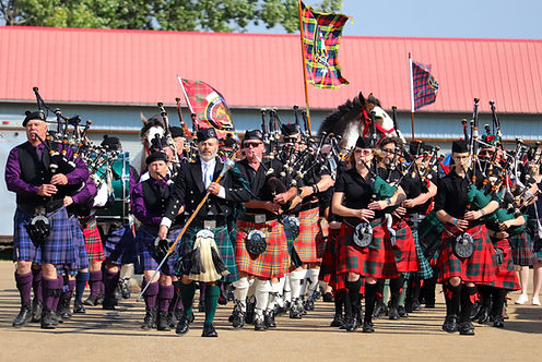 Mass Band of Bagpipers with Clydesdale horses