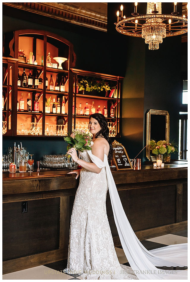 Bride in Bar at The Show Shea's Seneca in dramatic beaded wedding gown