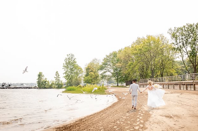 bride and groom on beach at Falconwood
