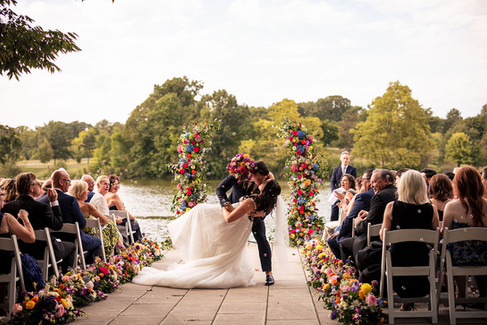 bride and groom get married next to lake 