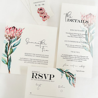 elegant wedding invitation suite with red floral design
