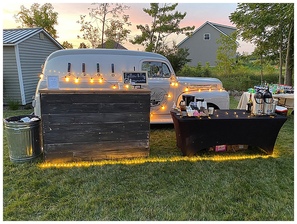 Vintage Taps wedding bar on display with lights, rustic setup and tea & coffee station