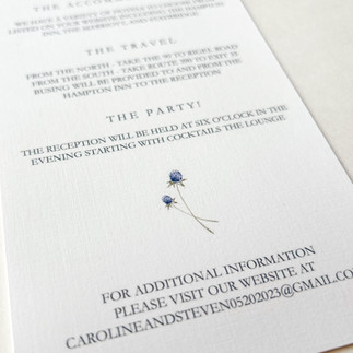 wedding invitation with simple and timeless font and simple blue floral design