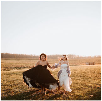 female couple in black and white wedding dresses, inclusive wedding dress shopping, black wedding dress, white wedding gown with sleves, WNY wedding dress shopping, Bridal Chateau 