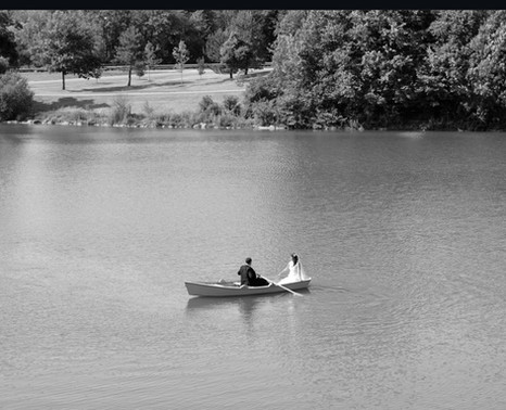 bride and groom on boat ride in Hoyt Lake