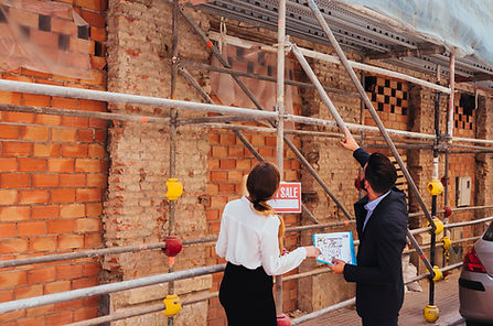 real-estate-agents-checking-construction-works.jpg