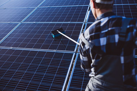 man-worker-firld-by-solar-panels.jpg