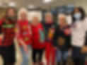 Mandeville Center members in their Christmas sweaters.