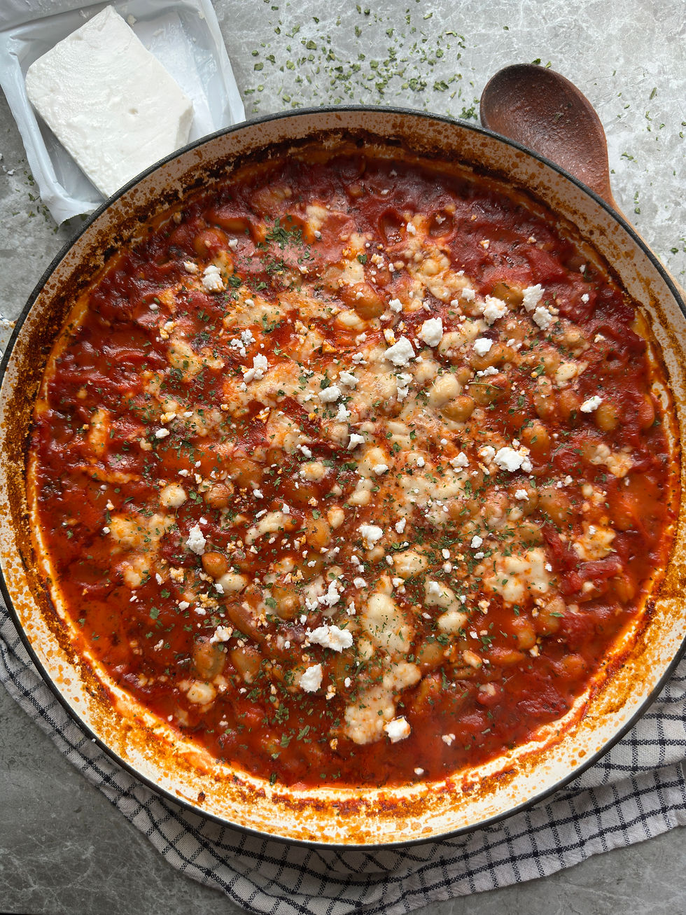 Creamy butter beans oven baked in a rich herby sauce topped with melted feta cheese.