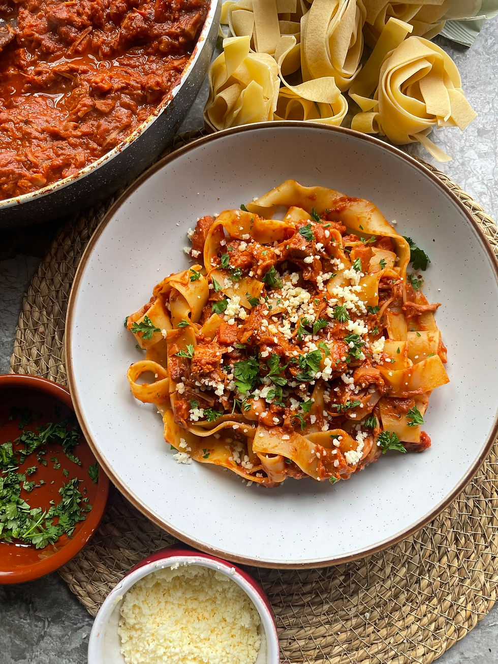 Rich tomato ragu with jackfruit coating thick papperdelle pasta